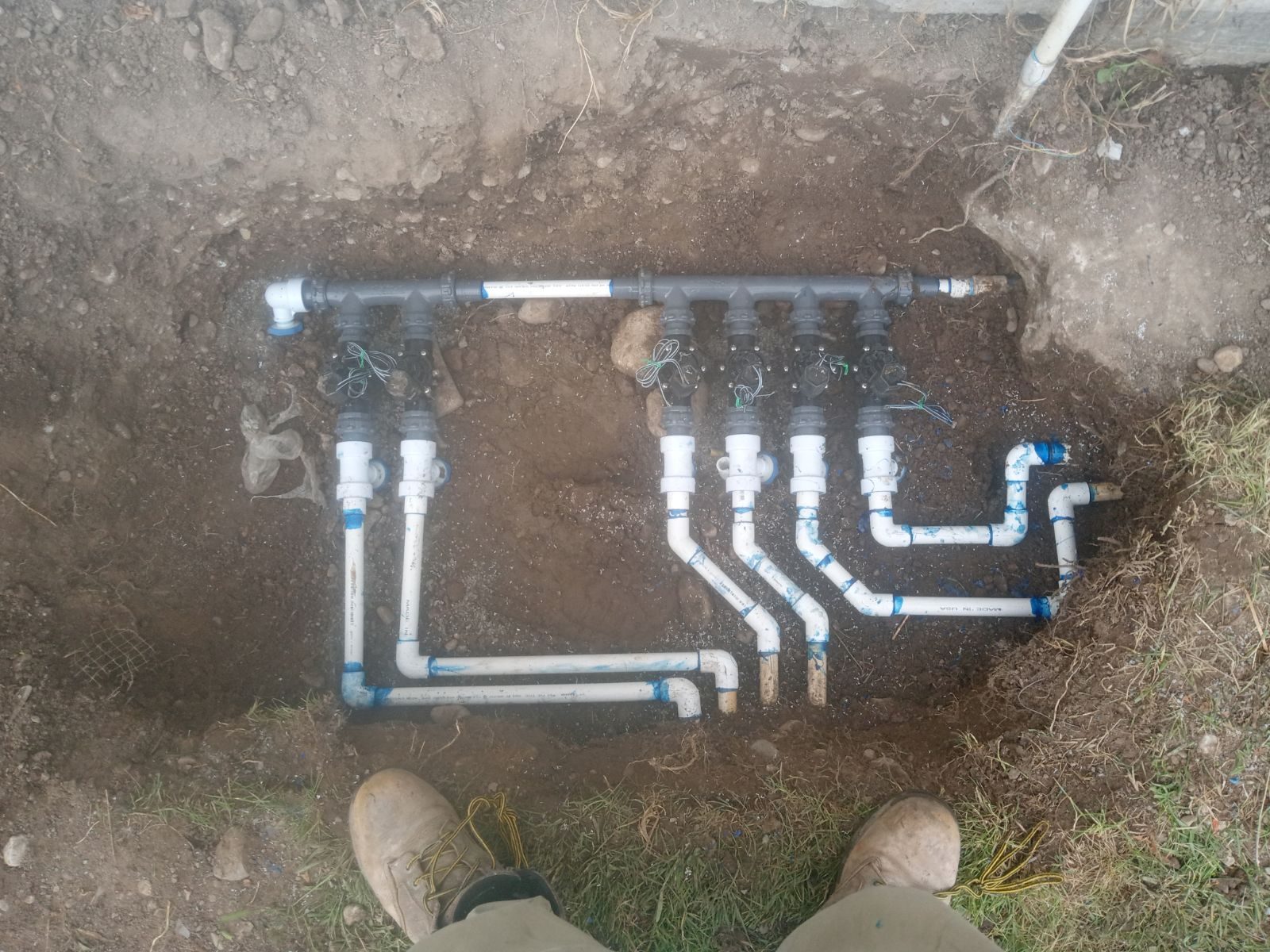 New multi-zone sprinkler valve manifold installed before backfill