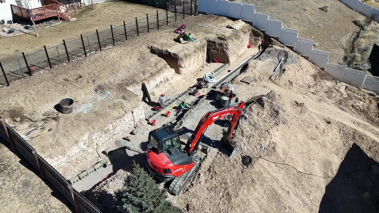 Drone view of the first wall courses being set in the trench