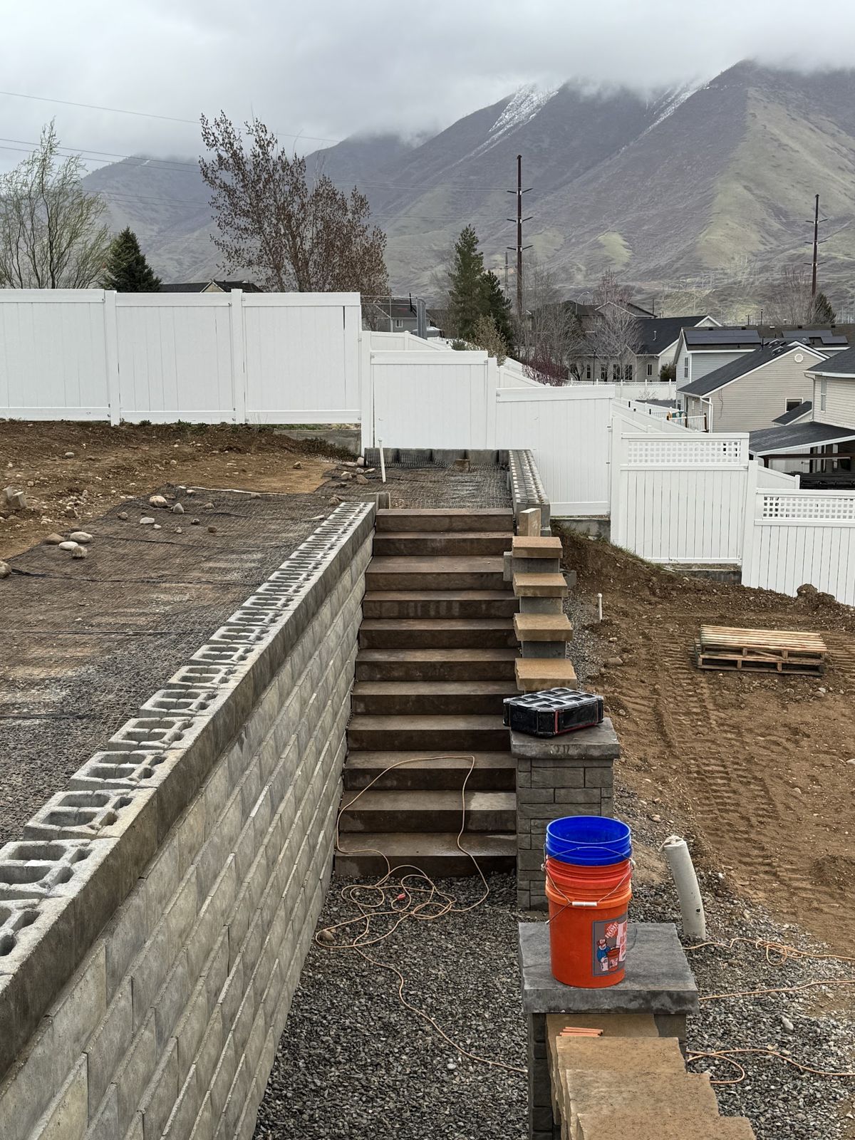 Block staircase built into the terraced retaining walls