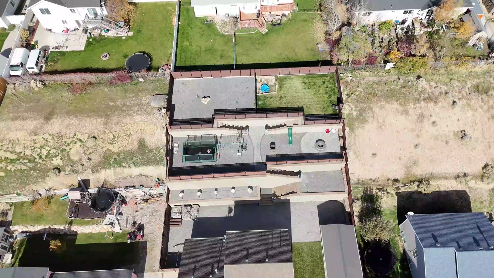 Overhead drone view of the finished three-tier retaining wall